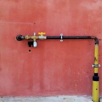Laying a gas pipeline in a case through the wall: specifics of the device for entering the gas pipe into the house