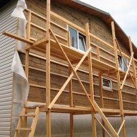 How to sheathe the outside of a wooden house: the best types of materials and technologies for their installation