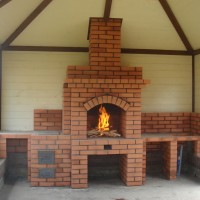 Brick stoves for a wood-burning cottage: the best arrangements and step-by-step construction guide