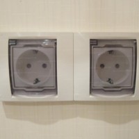 Where should outlets be located in the bathroom?