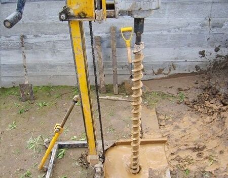 Drilling a hole with a needle auger