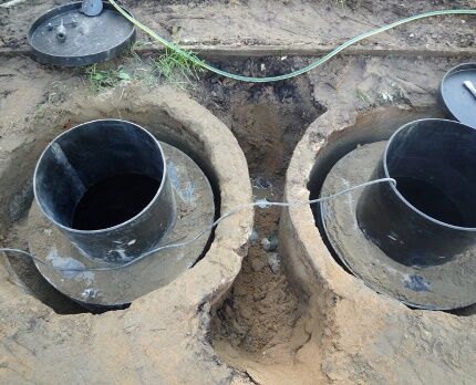 Waterproofing a septic tank by installing a plastic insert