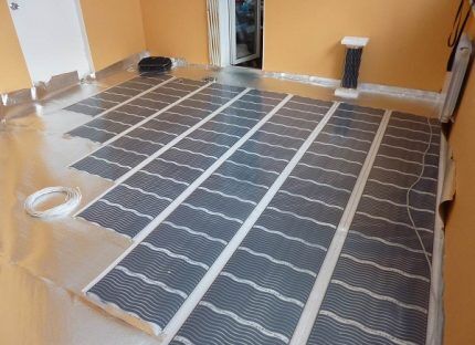 Laying film heated floors
