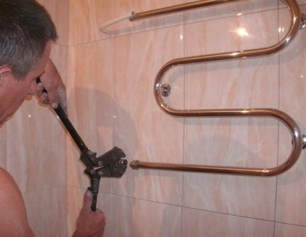 Removing the heated towel rail
