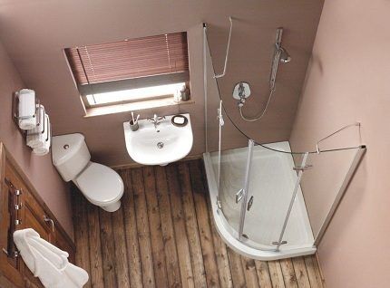 Bathroom with corner toilet