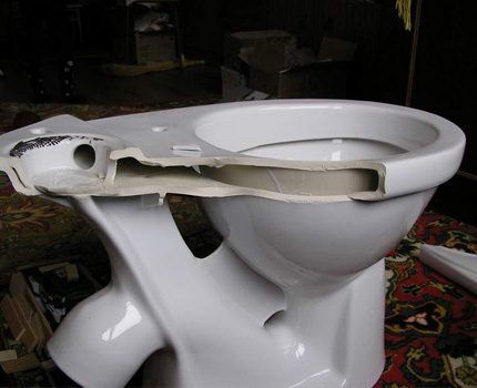 The toilet is badly damaged