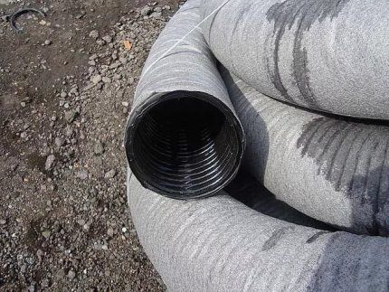 Drains with geotextiles