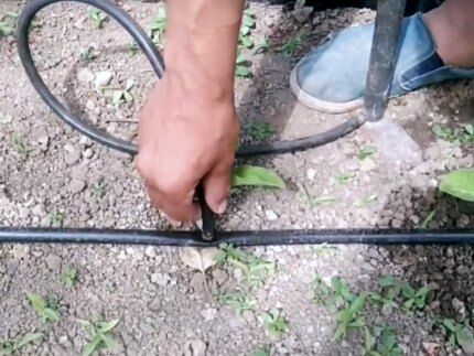 Using a foot pump to clear a blockage in a tube