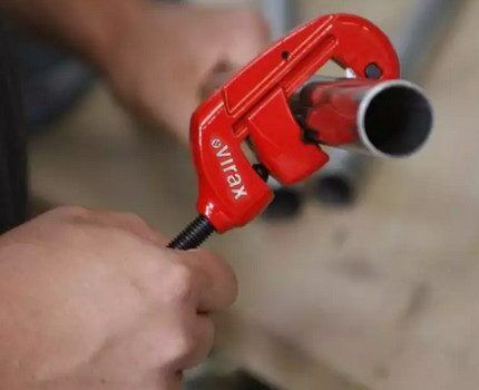 Manual pipe cutter at work
