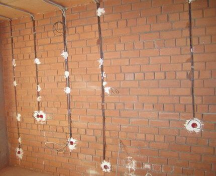 Laying electrical wiring on a brick wall