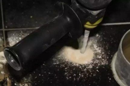 Drilling a hole in a tile with a drill