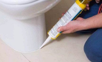 Installing a toilet with sealant