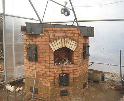 Stone stove for greenhouse