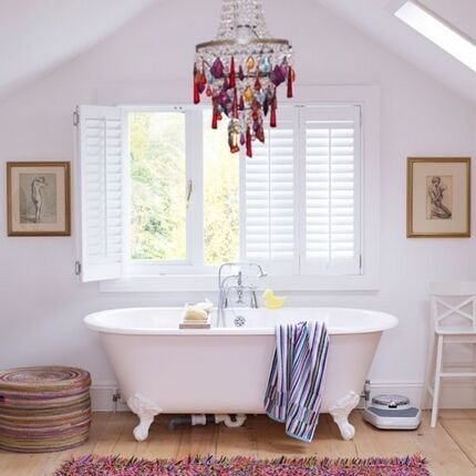 Colored crystal chandelier over the bath