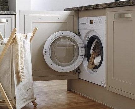 Loading clothes into the washing machine