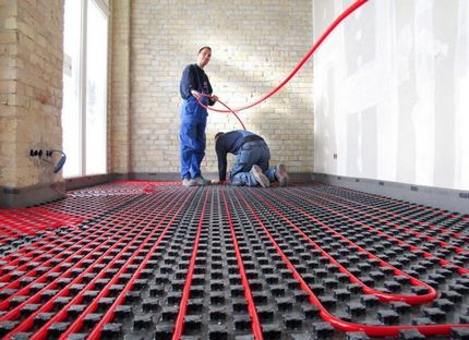 Laying pipes for heated floors by professionals