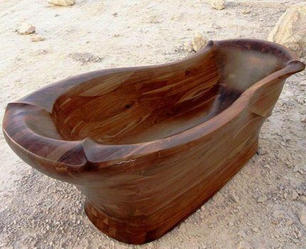 Unusual shape of a wooden bathtub