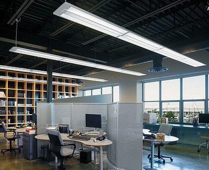 Office illuminated by fluorescent lamps