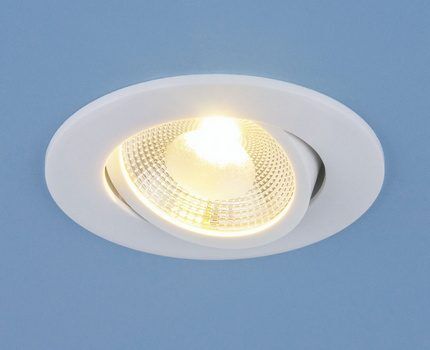 Lamp in a rotating spotlight