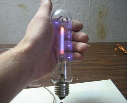 Sodium lamp in user's hand 