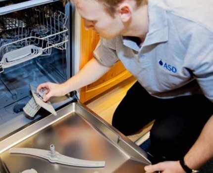 Master servicing the dishwasher