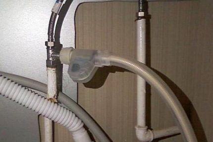 The hose is connected using a tee