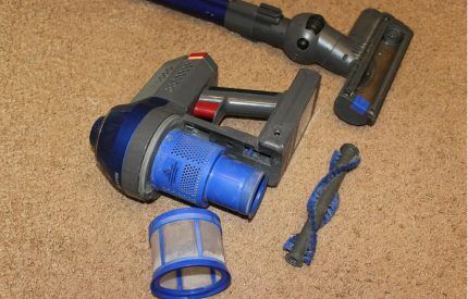 Disassembled upright vacuum cleaner