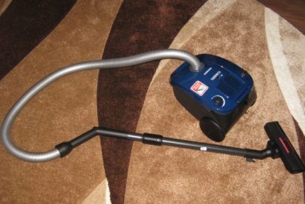 Vacuum cleaner on the carpet