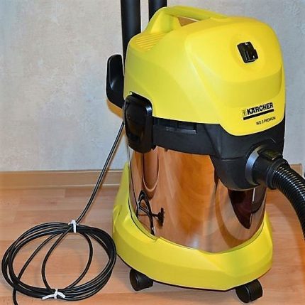 The vacuum cleaner is stored in the corner of the room