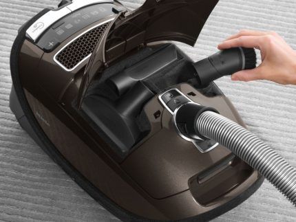 Miele vacuum cleaner with a compartment for storing attachments