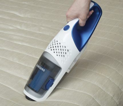 Using a handheld vacuum cleaner