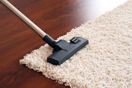 Cleaning the carpet with a turbo brush