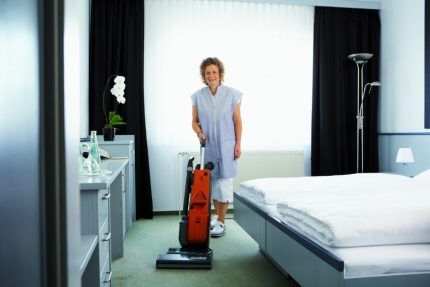 Woman with silent vacuum cleaner