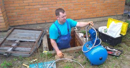 A foreman installs a pumping station