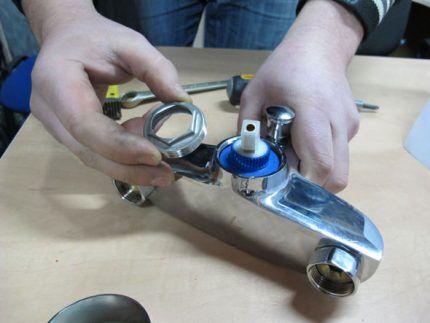 Disassembling a single lever mixer