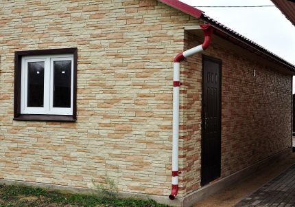 Façade cladding with basement siding