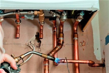 Soldering copper pipes of a boiler