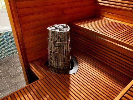 Stove with stones in the interior of the steam room