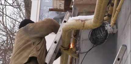 A technician welds a puncture in a gas pipe
