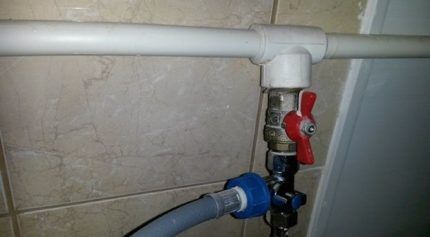 Tapping into a pipe using a ball valve