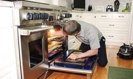 Master repairing an oven