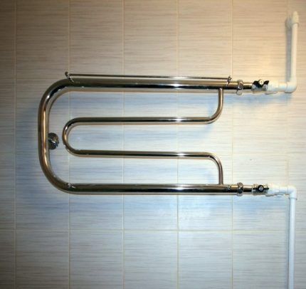 Wall connected heated towel rail