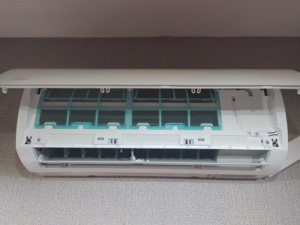 Air conditioner with open panel 
