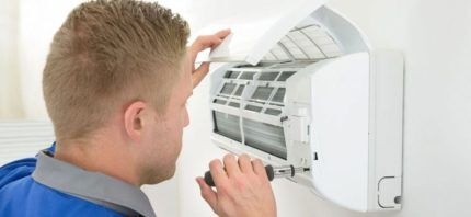 Master repairs air conditioner