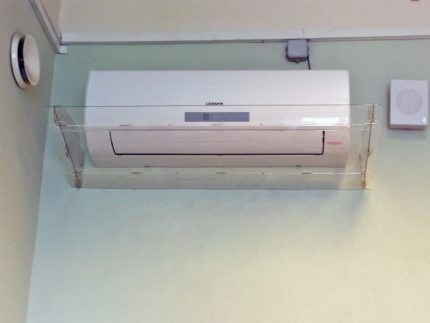 Air conditioner with protective screen