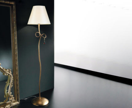 Floor lamp with metal base and glass shade