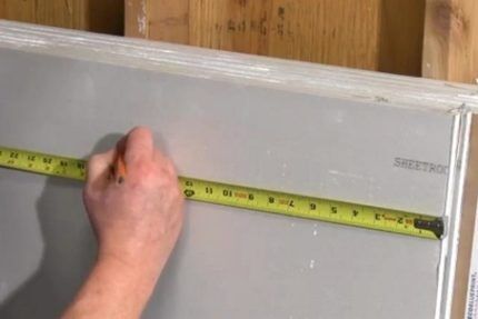 Marking a sheet of drywall