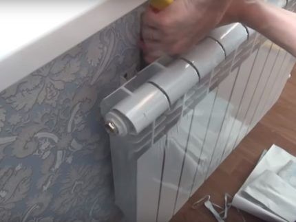 Wallpapering around batteries