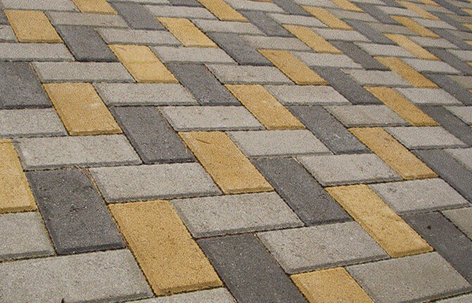 Laying tiles with a braided pattern