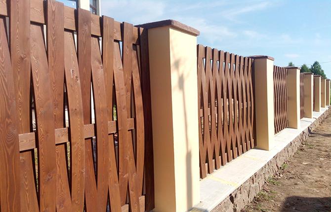 Fence made of boards installed vertically